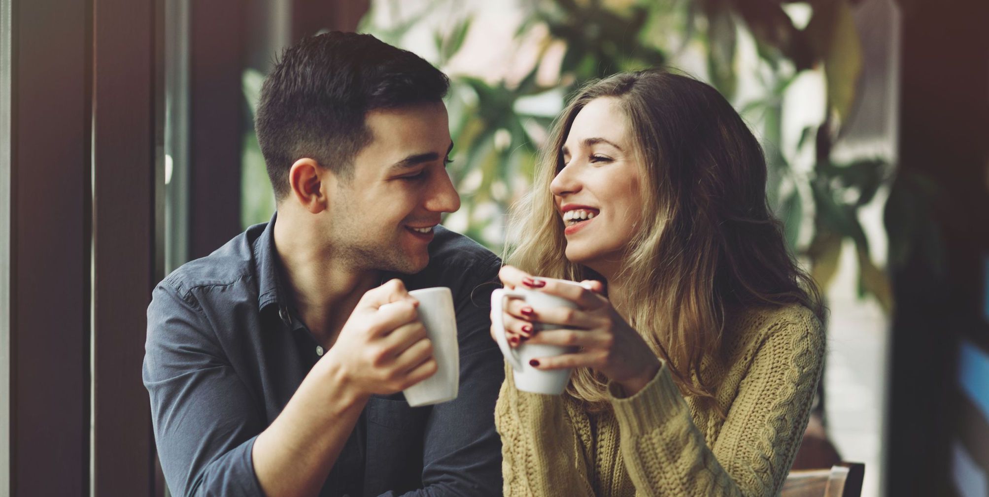 50766349 - couple in love drinking coffee and have fun in coffee shop. love concepts. vintage effect style picture